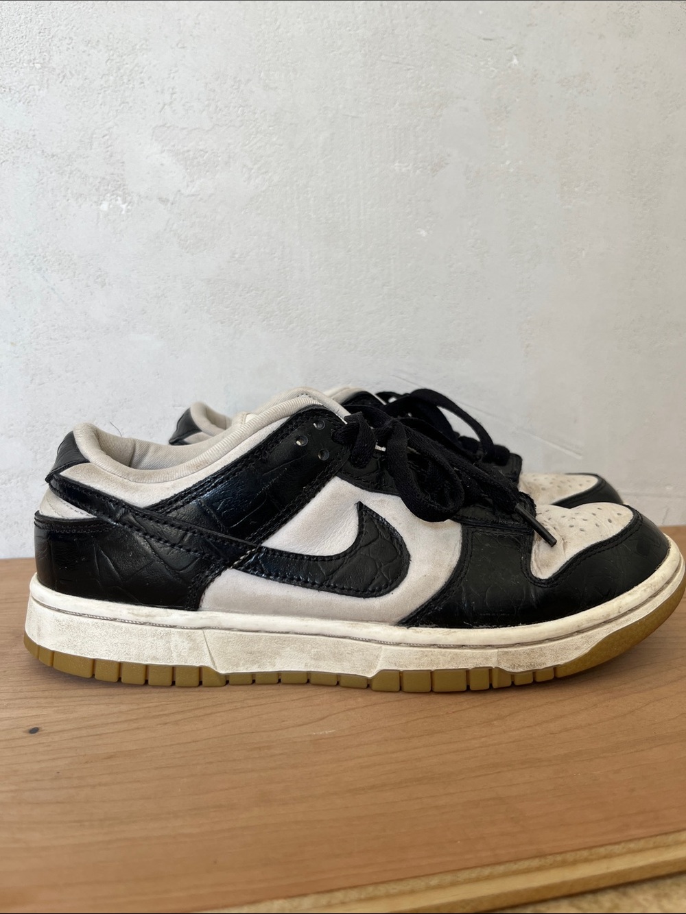 Nike Panda Dunks black snake skin leather brown and white sole.